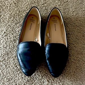 Pointy toed black memory foam flats.